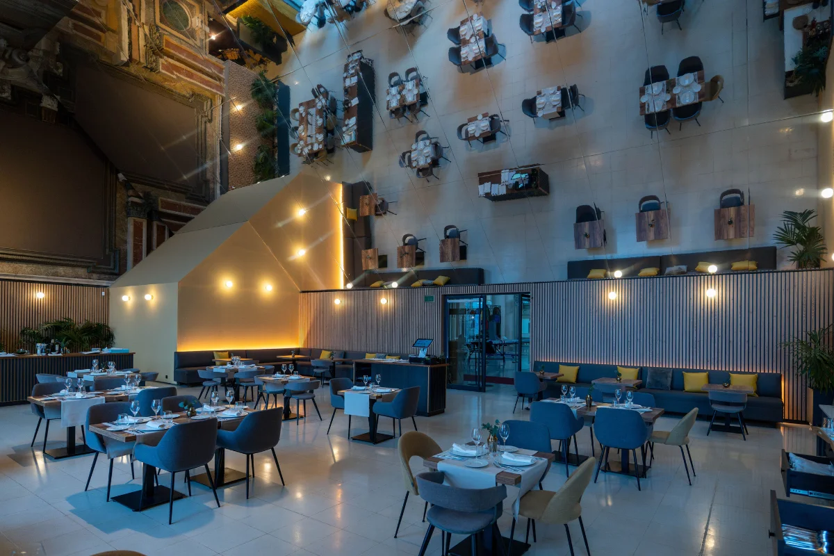Absis restaurant interior at MNAC Barcelona with tables set and Modernista architecture in the background