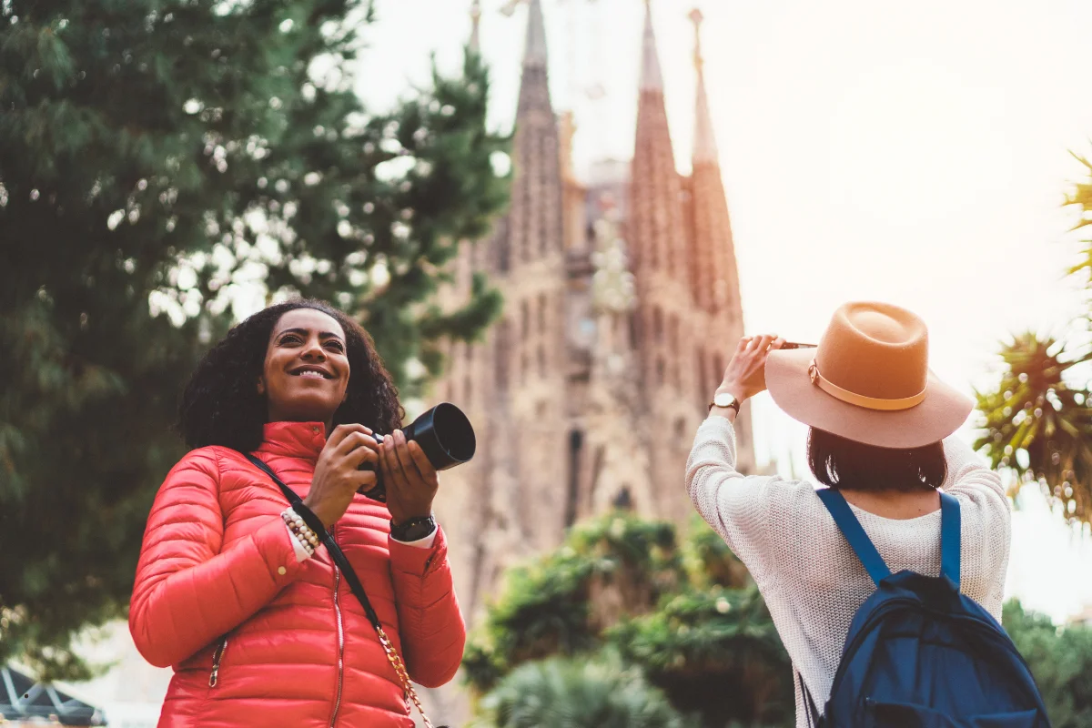 360-degree panoramic view of Barcelona from the Bunkers del Carmel at golden hour, Sagrada Família and the Mediterranean in the background